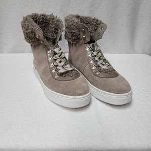 Sam edelman Luther high top sneaker with sherpa cuffs on top.